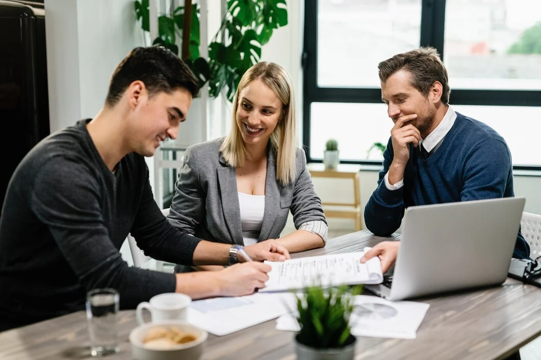 Investment advisors reviewing property strategy